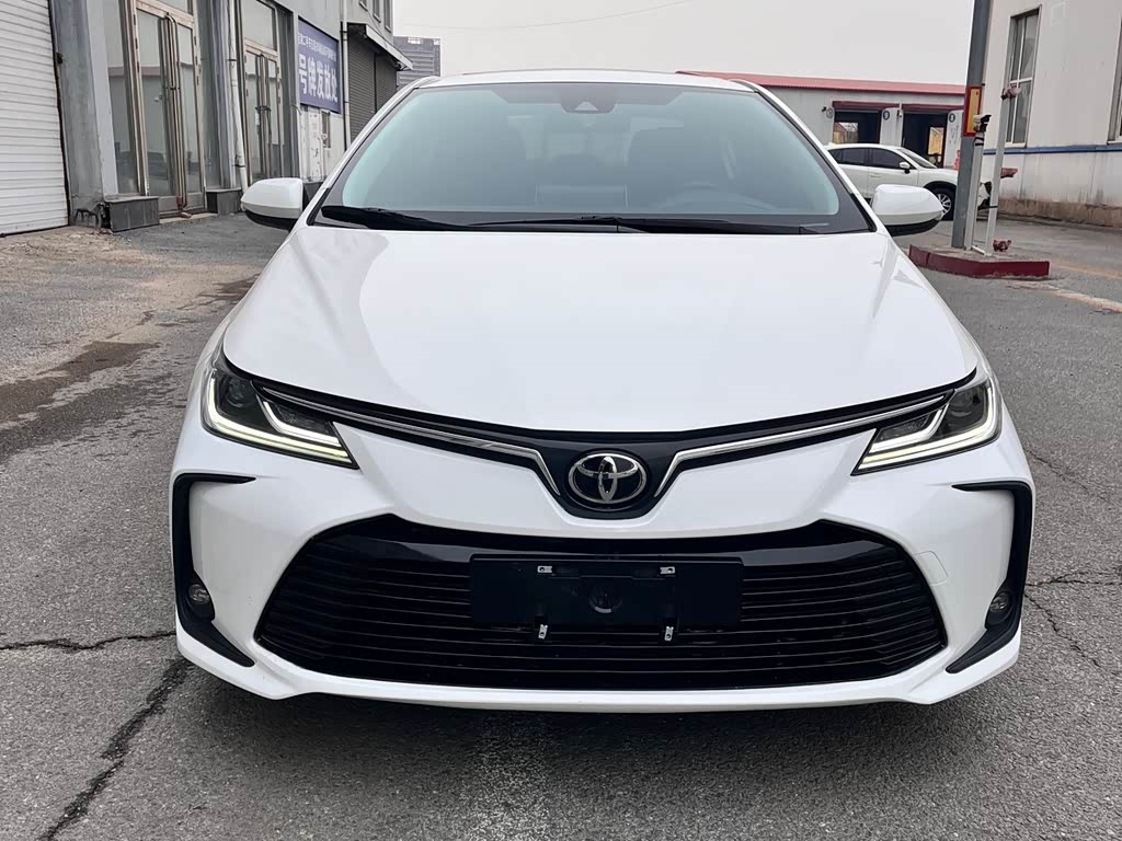 Rear three-quarter view of a 2021 Toyota Corolla sedan