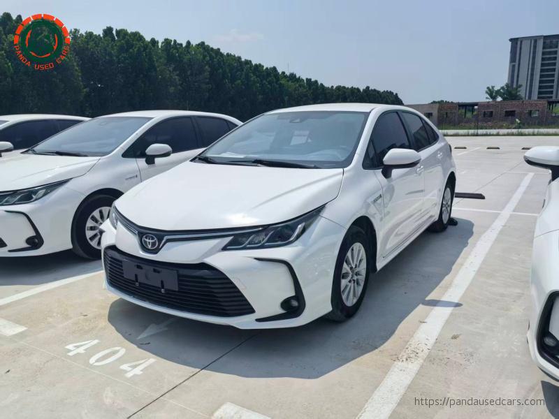 White 2021 Toyota Corolla Hybrid sedan, representative export vehicle